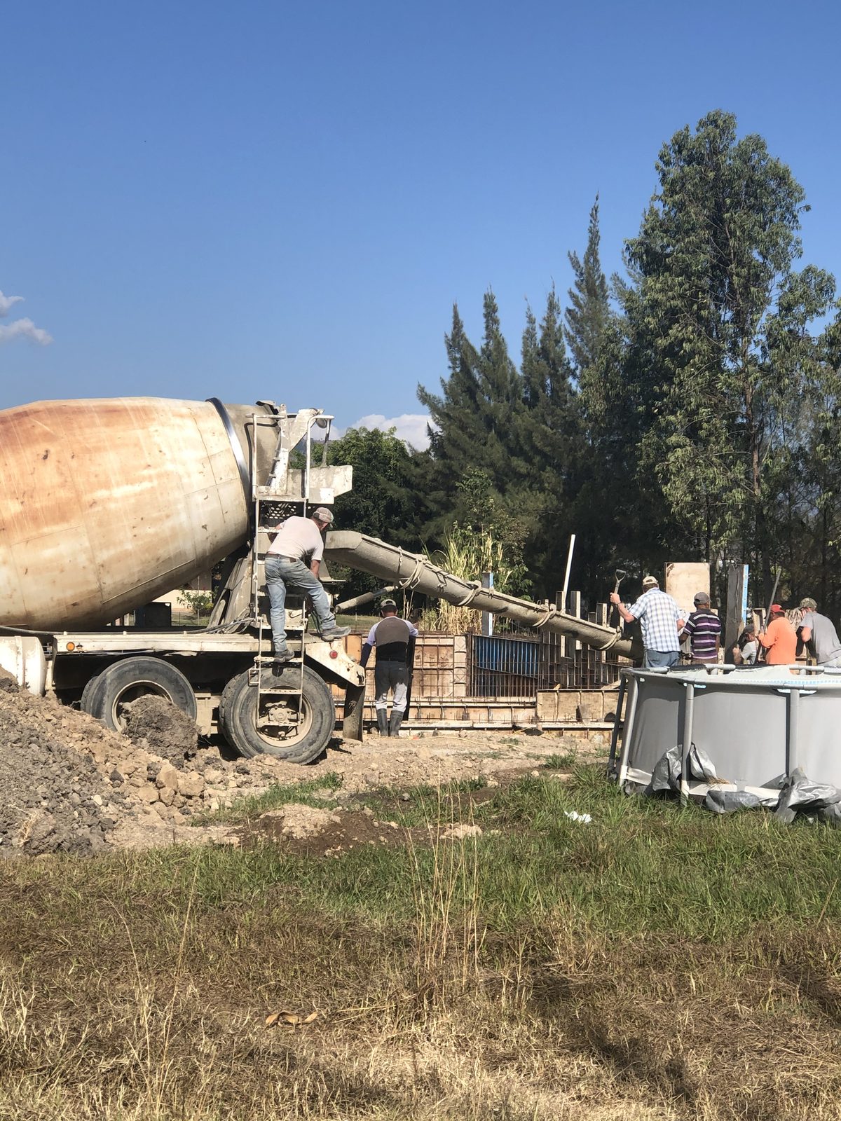 A concrete pour for the foundation of the Adonai International Ministries hospital in Canillá, Guatemala