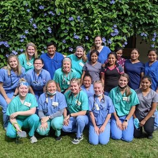The volunteer medical team — nurses and clinicians — gathered outside the Adonai clinic in Canillá, Guatemala